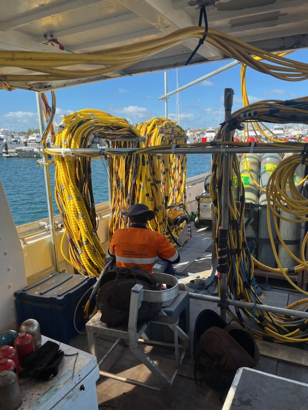 Surface-supply dive umbilicals racked on deck