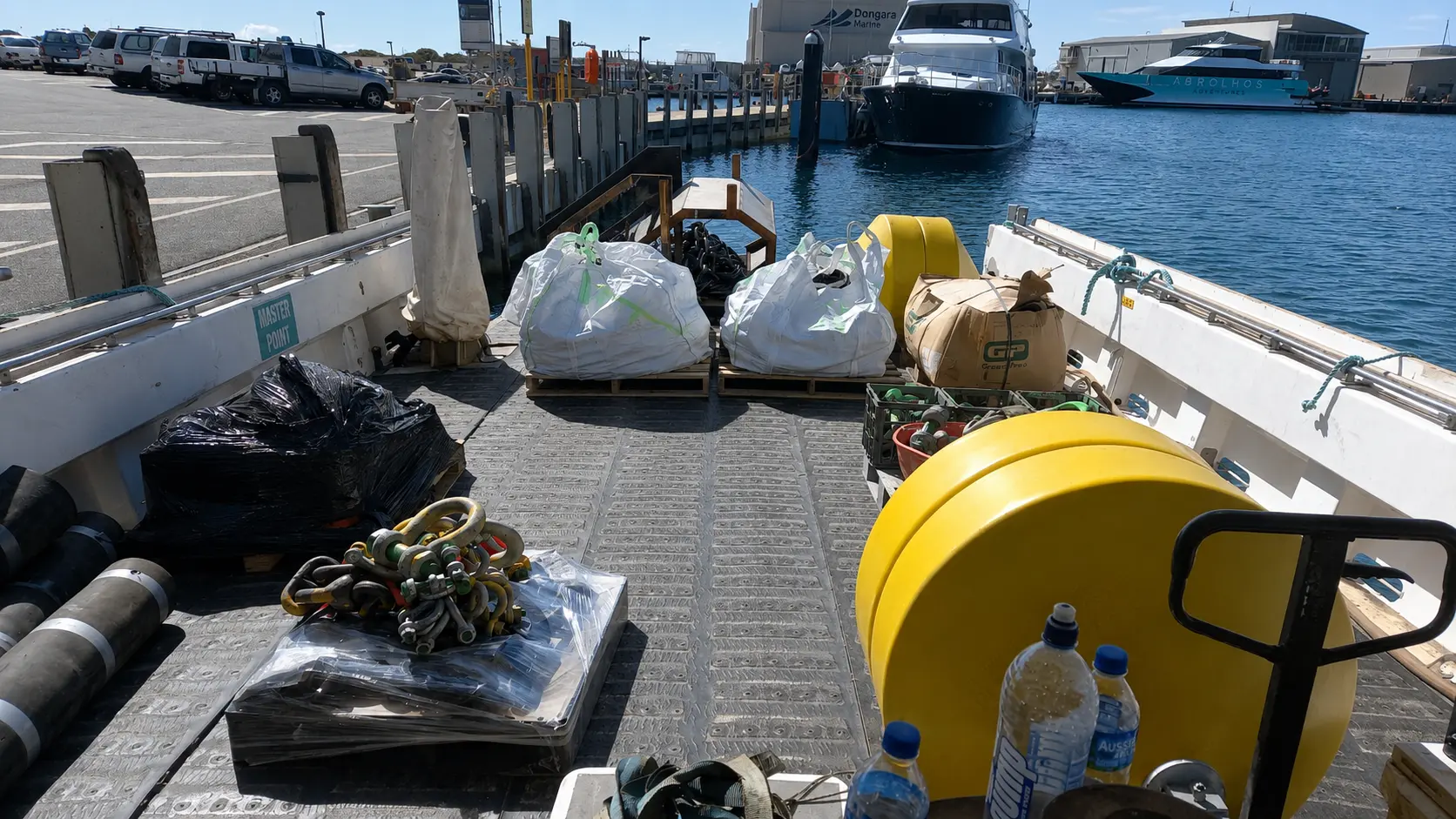 Deck loaded with pallets, buoys and rigging at Dongara Marine